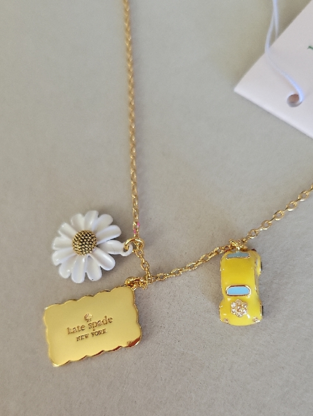 Kate Spade Gold Chain Necklace with Daisy, Yellow Car & 'Girls Trip' Charm - Picture 7 of 8